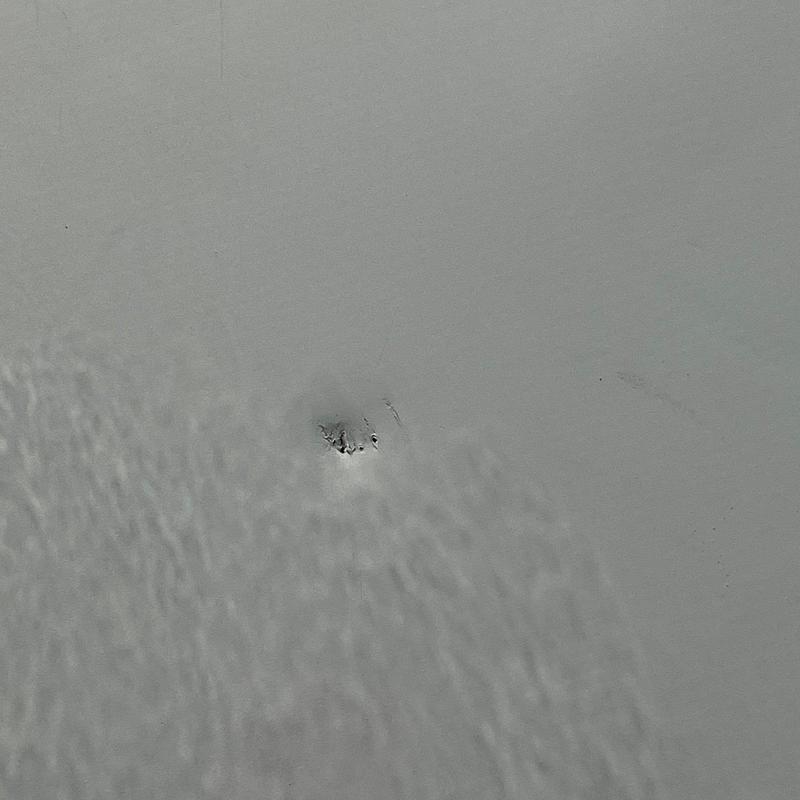 Concrete roof with small damaged area close-up Concrete roof with small damaged area close-up