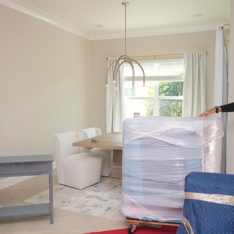 Wrapped dining room furniture for moving and storage.