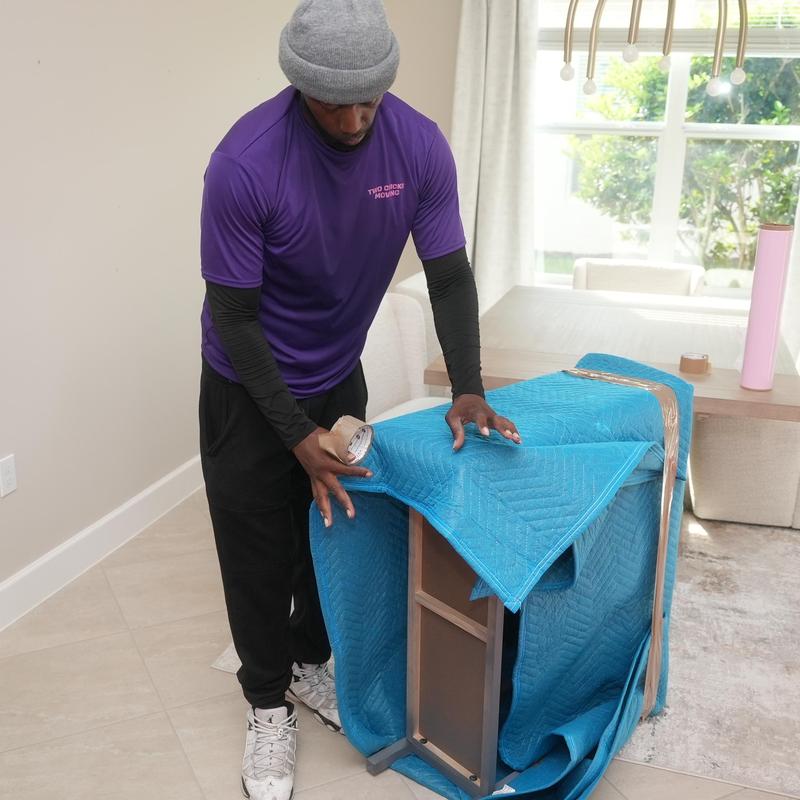 Furniture moving blanket wrap with tape in home
