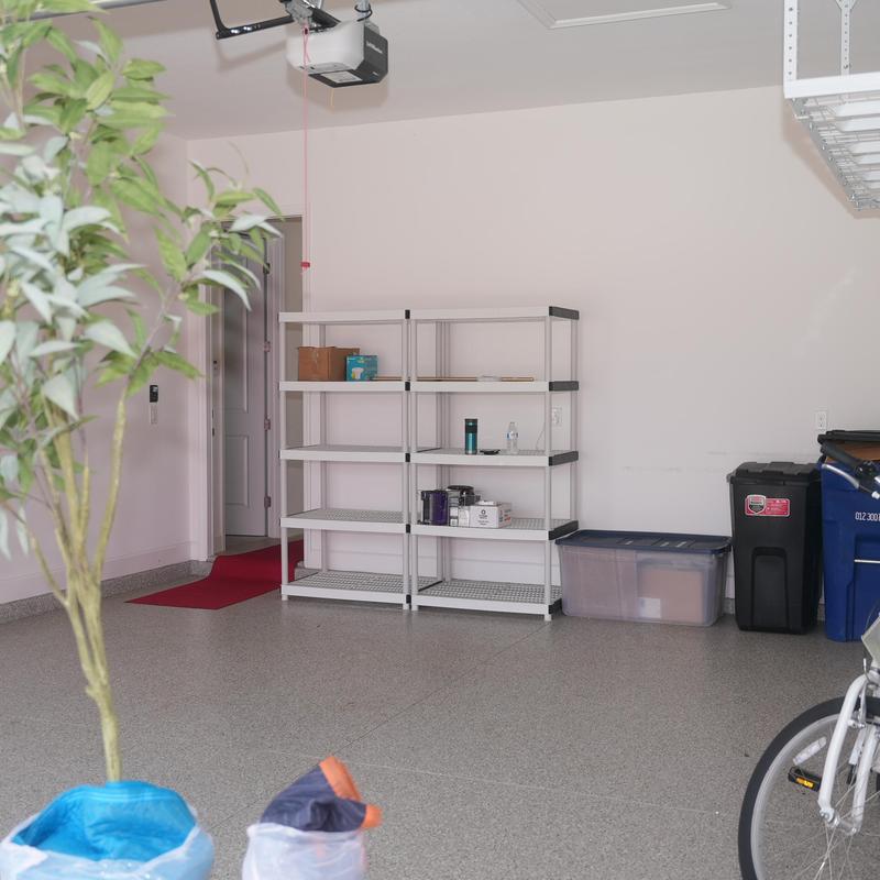 Storage shelving unit with packed moving boxes