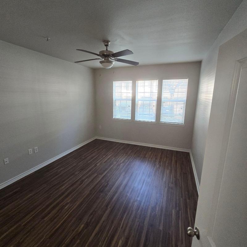 Ceiling fan and wood flooring in empty room Ceiling fan and wood flooring in empty room