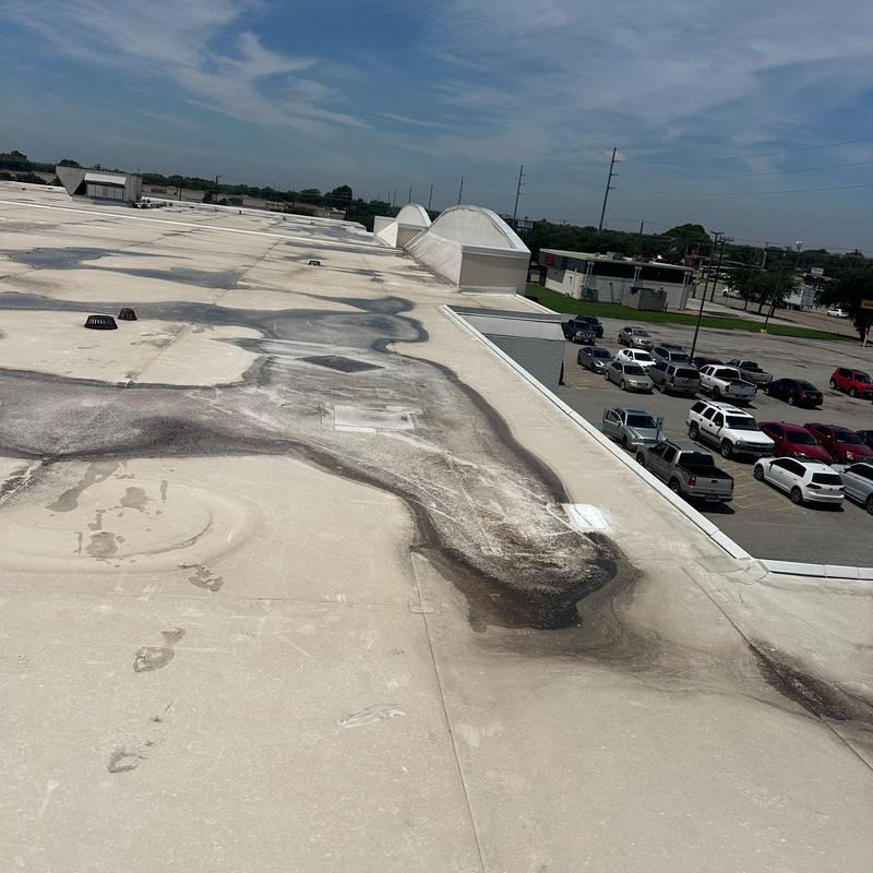 Concrete roof with hail damage and repair areas Concrete roof with hail damage and repair areas