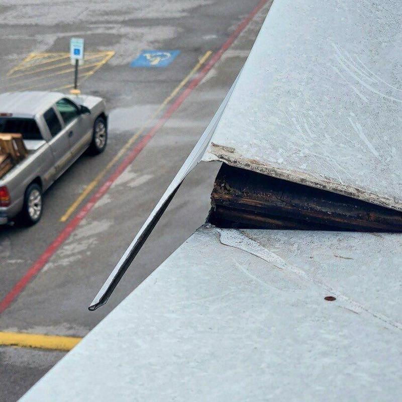 Concrete roof corner with lifted metal flashing Concrete roof corner with lifted metal flashing