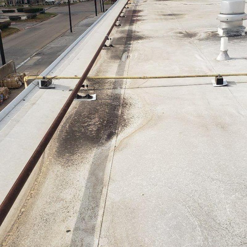 Concrete roof with discoloration and piping system Concrete roof with discoloration and piping system
