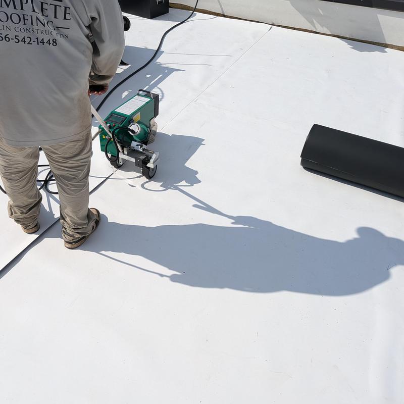 TPO roofing installation with heat welding machine