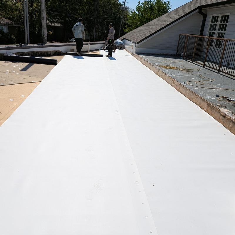 TPO roofing membrane installation on flat roof