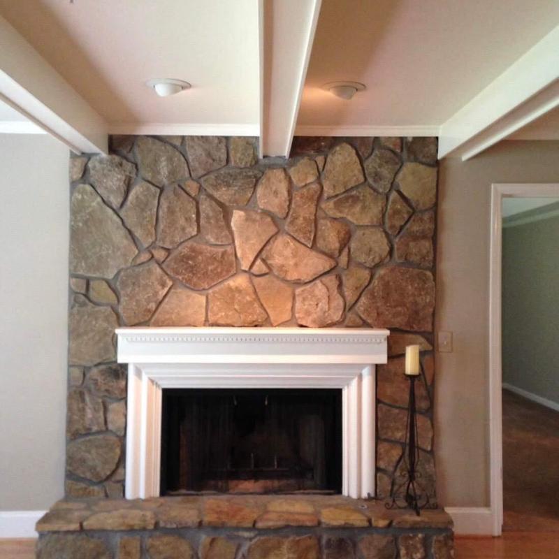 Stone fireplace surround with white mantel and hearth Stone fireplace surround with white mantel and hearth