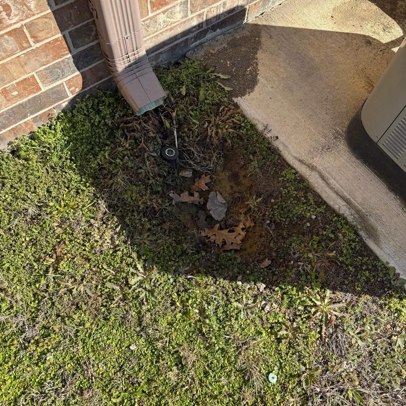 Downspout extension and lawn drainage near concrete slab Downspout extension and lawn drainage near concrete slab