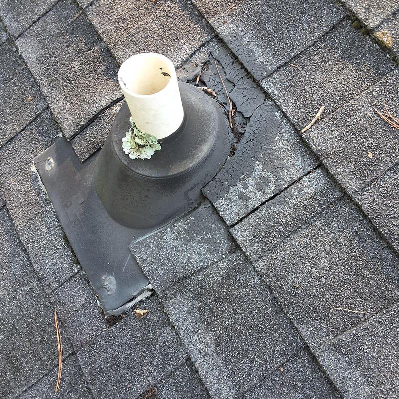 Roof vent flashing with cracked shingles and wear Roof vent flashing with cracked shingles and wear