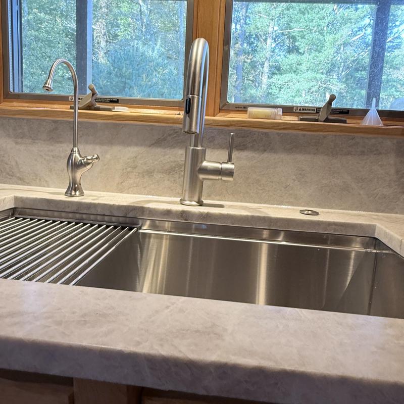 Kitchen sink with modern stainless steel faucets and drain Kitchen sink with modern stainless steel faucets and drain