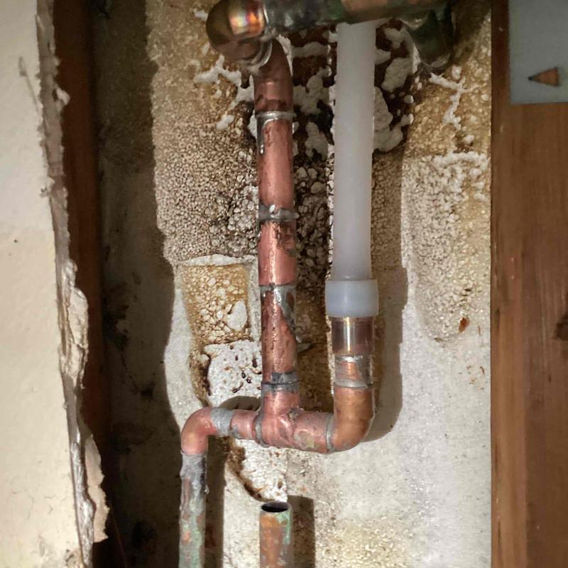 Hot water line with copper and PEX piping reroute