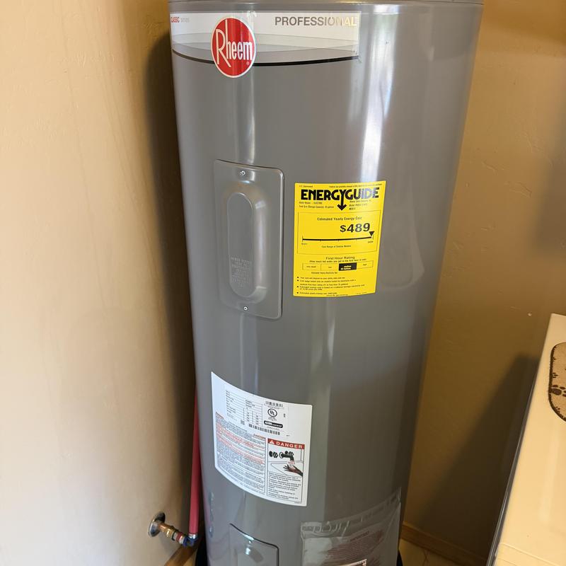 Electric water heater with energy guide label installed Electric water heater with energy guide label installed