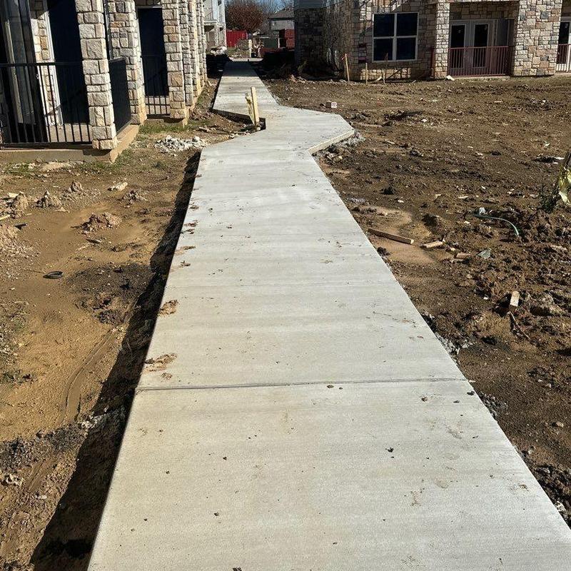Concrete sidewalk installation at residential property Concrete sidewalk installation at residential property