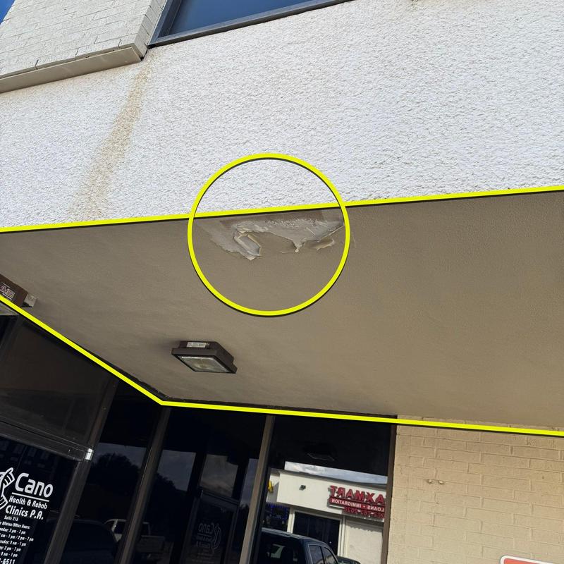 Stucco ceiling damage on commercial building exterior Stucco ceiling damage on commercial building exterior
