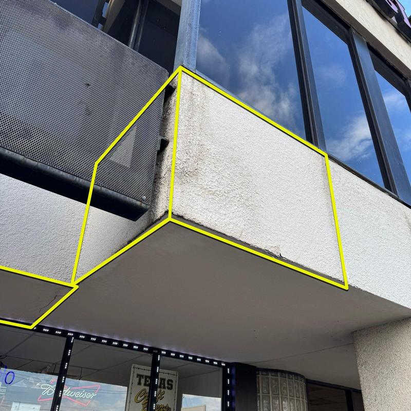 Concrete balcony edge with surface aging and repair marks Concrete balcony edge with surface aging and repair marks