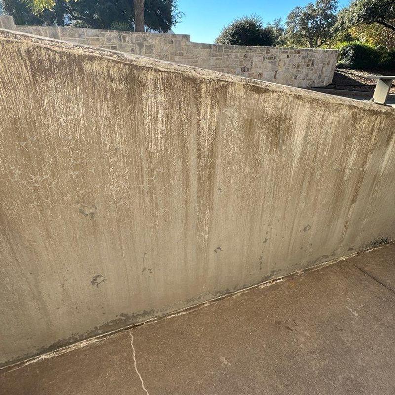 Stucco wall with water stains and discoloration outdoors Stucco wall with water stains and discoloration outdoors