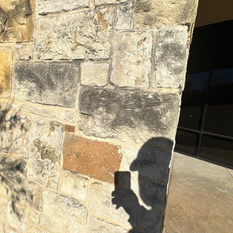Stone wall replacement on commercial building exterior Stone wall replacement on commercial building exterior