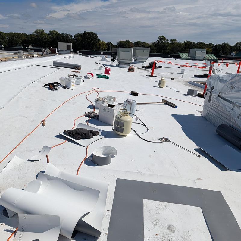 TPO single ply membrane installation on commercial roof