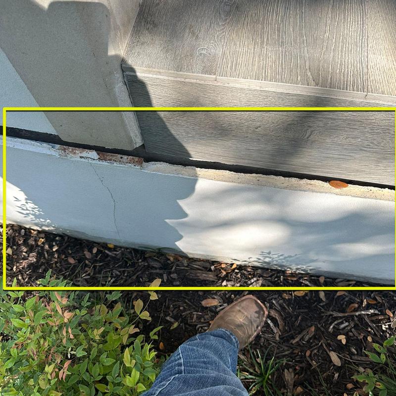 Stucco wall crack near porch deck base outdoors Stucco wall crack near porch deck base outdoors