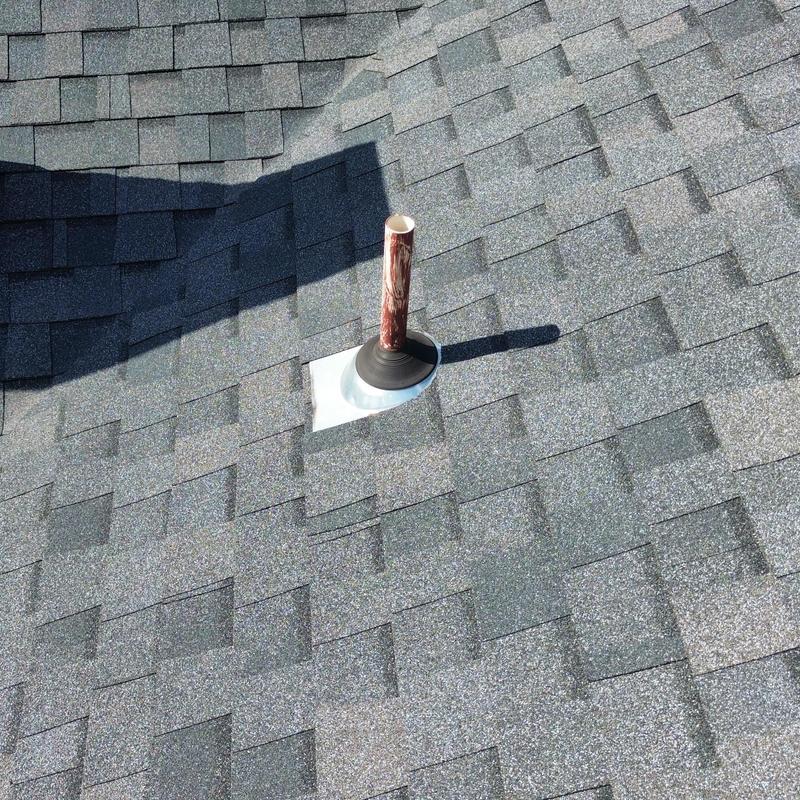 Roof vent pipe flashing with new shingles installation Roof vent pipe flashing with new shingles installation