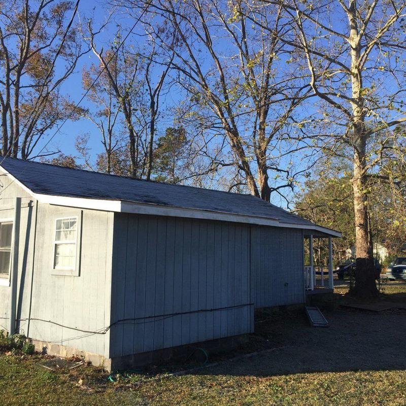 Shingle roof storm damage repair on small house