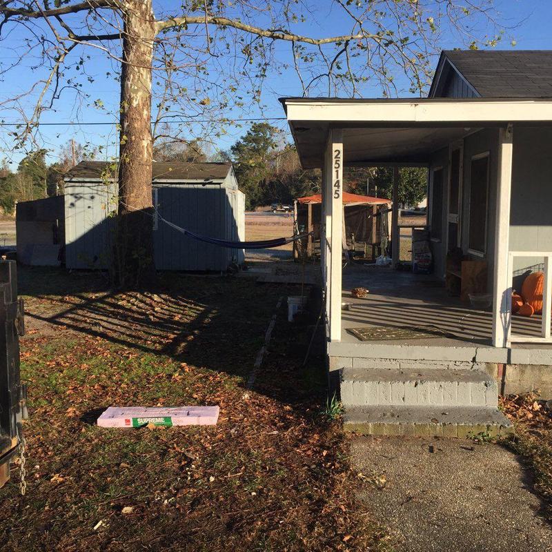 Roof shingles repair on residential porch roof