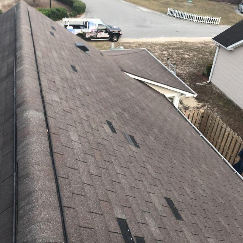 Brown asphalt shingle roof with ridge vents