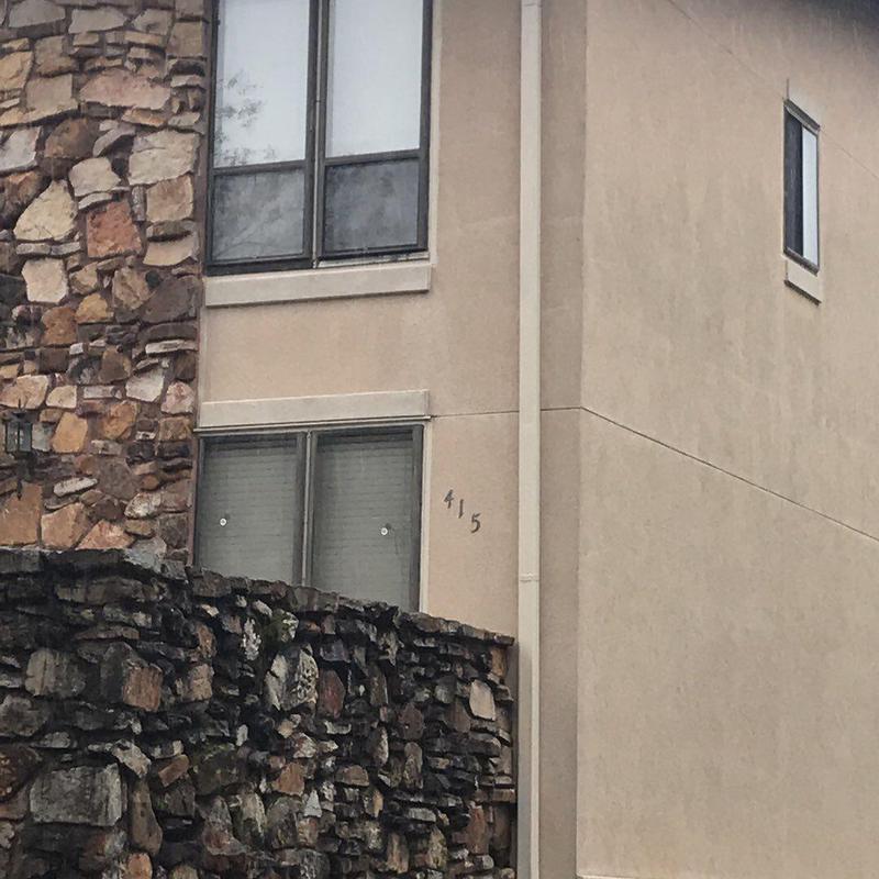 Concrete wall and stone facade on condo building