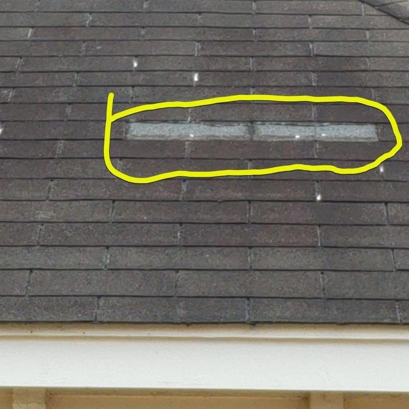Asphalt shingle roof with damaged and missing shingles