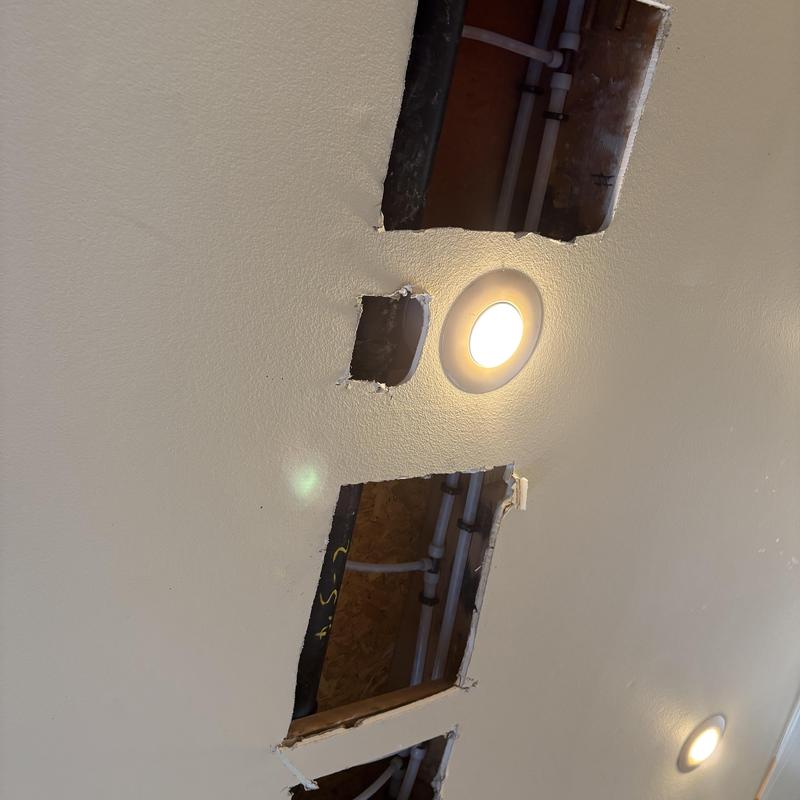 PEX water piping behind ceiling drywall holes