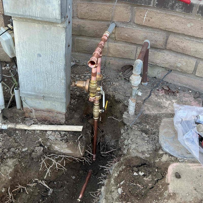 Copper water service line installation near meter