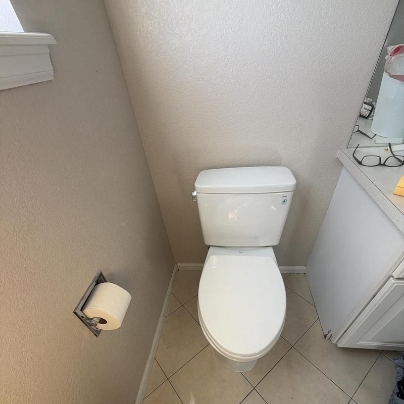 Toilet installation in small bathroom corner