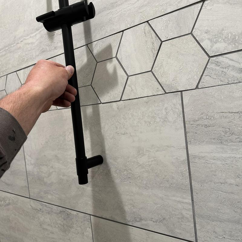 Slide bar handheld showerhead installation on tiled wall Slide bar handheld showerhead installation on tiled wall