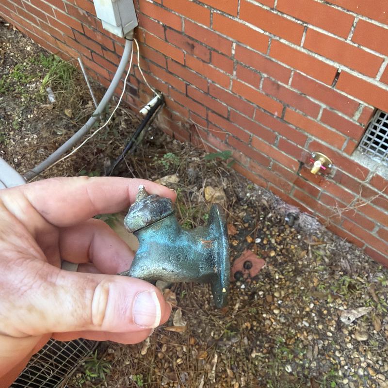 Outdoor hose bibb valve replacement near brick wall Outdoor hose bibb valve replacement near brick wall