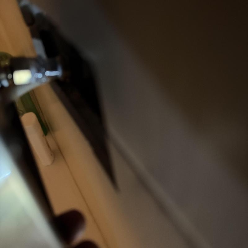 Kitchen faucet handle and countertop edge close-up