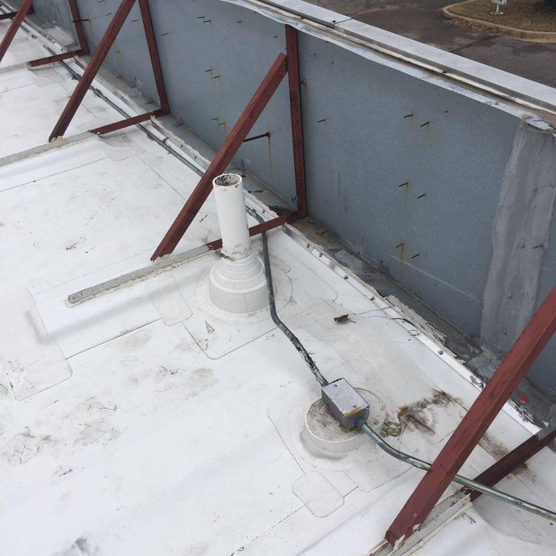 Low-slope roof drains and flashing repairs