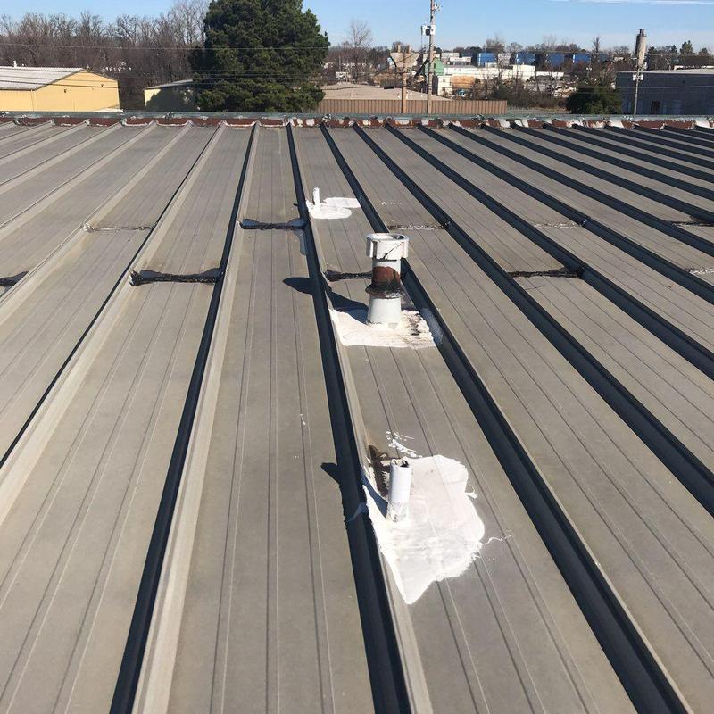 Metal roof penetrations and flashing with sealant patches