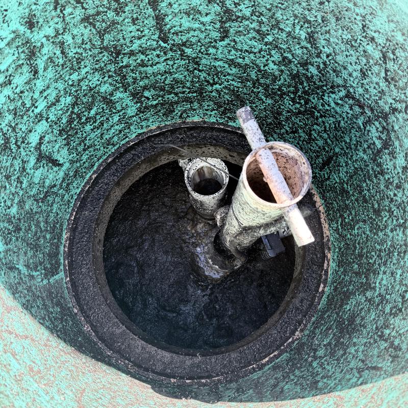 Septic tank inlet pipes with sludge buildup inside Septic tank inlet pipes with sludge buildup inside