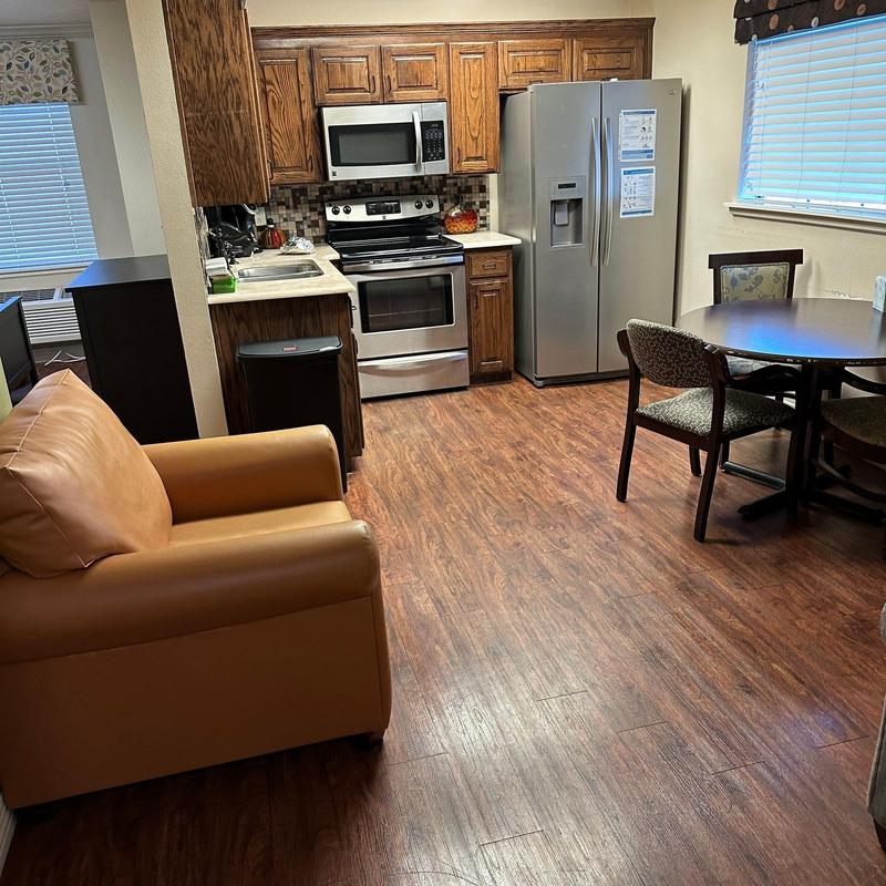 Wood-look vinyl flooring in kitchen and dining area Wood-look vinyl flooring in kitchen and dining area