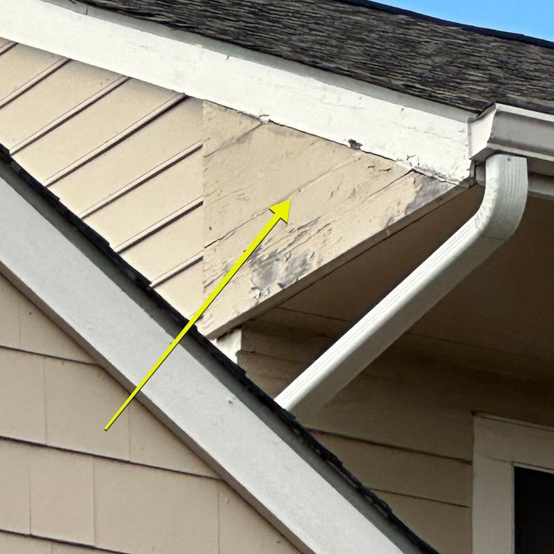 Wood fascia board repair with damaged paint and cracks Wood fascia board repair with damaged paint and cracks