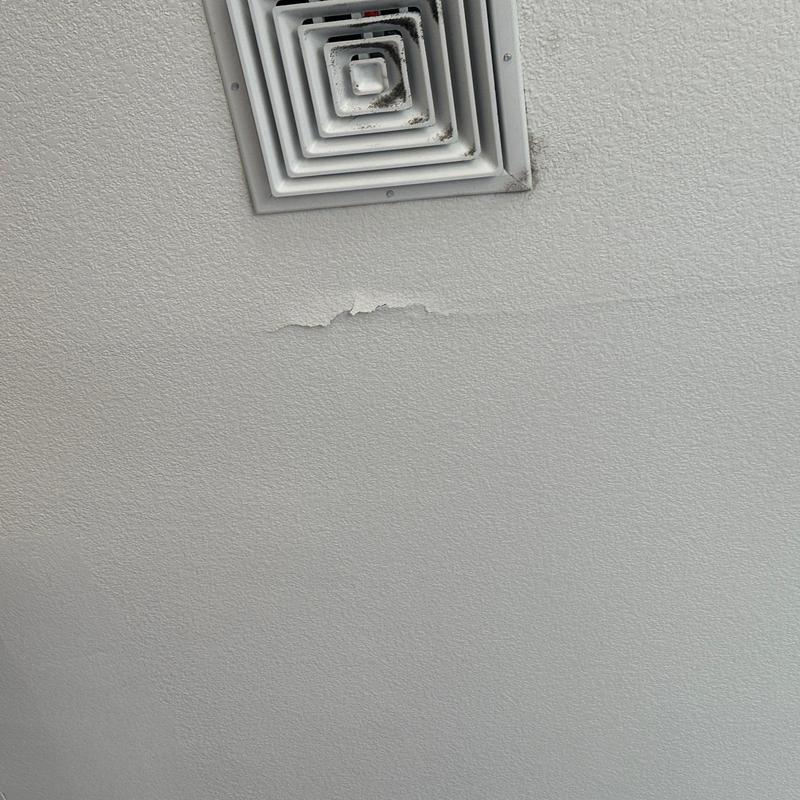 Ceiling texture with water damage near vent Ceiling texture with water damage near vent