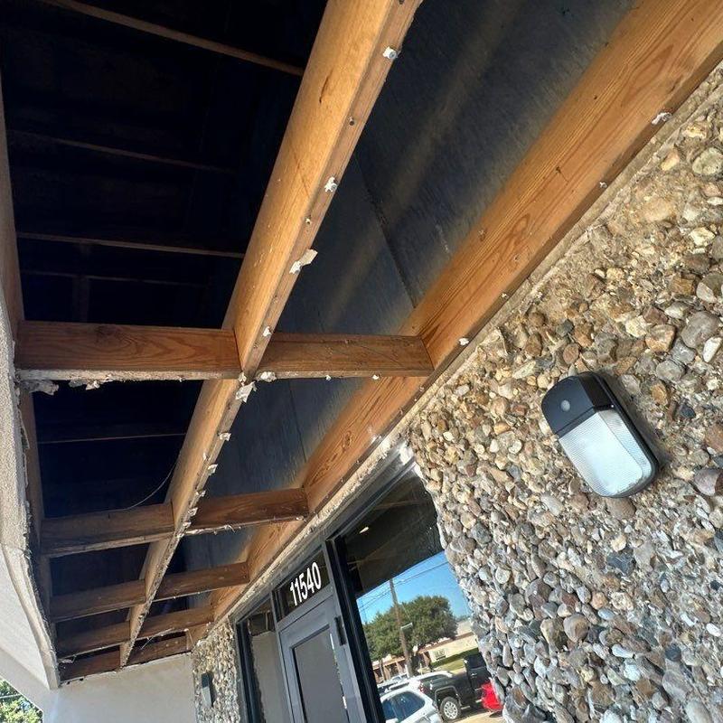 Concrete wall with wood frame and exterior light fixture Concrete wall with wood frame and exterior light fixture