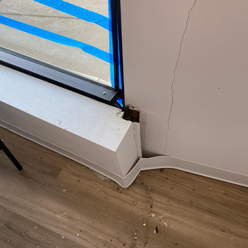 Concrete window sill and wall corner damage with crack Concrete window sill and wall corner damage with crack