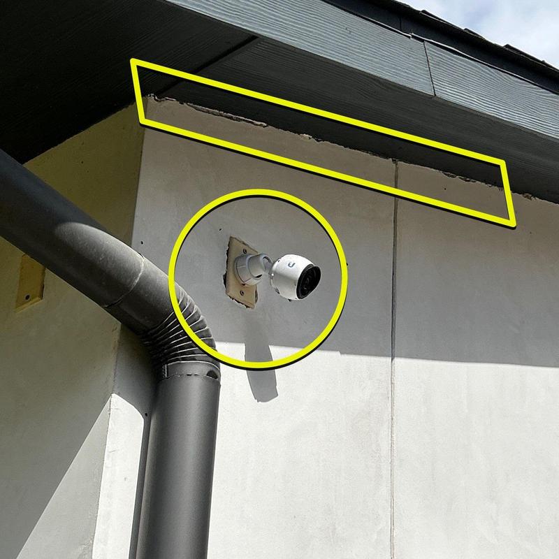 Stucco exterior wall damage and outdoor security camera Stucco exterior wall damage and outdoor security camera