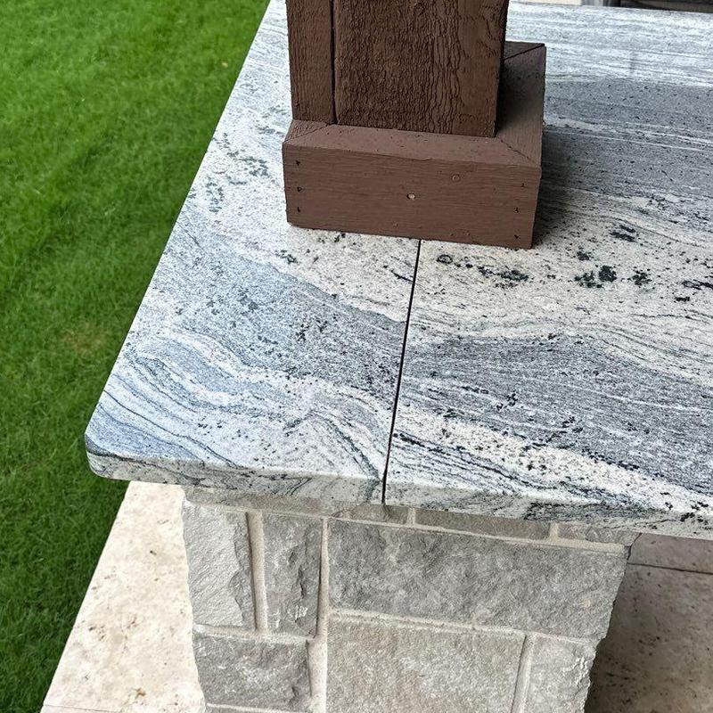 Granite countertop with wooden post base detail Granite countertop with wooden post base detail