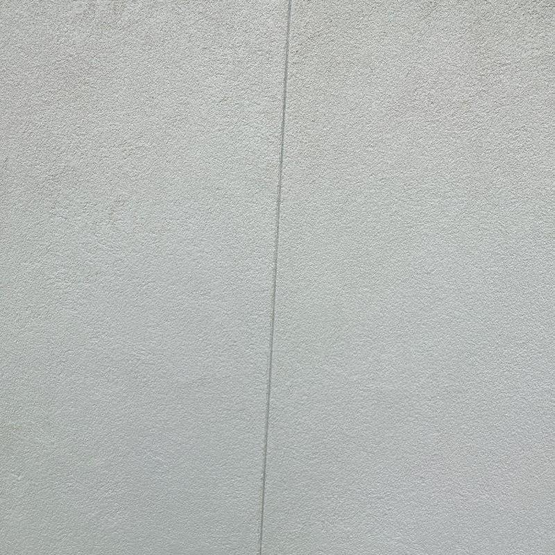 Stucco wall seam with fresh repair finish Stucco wall seam with fresh repair finish