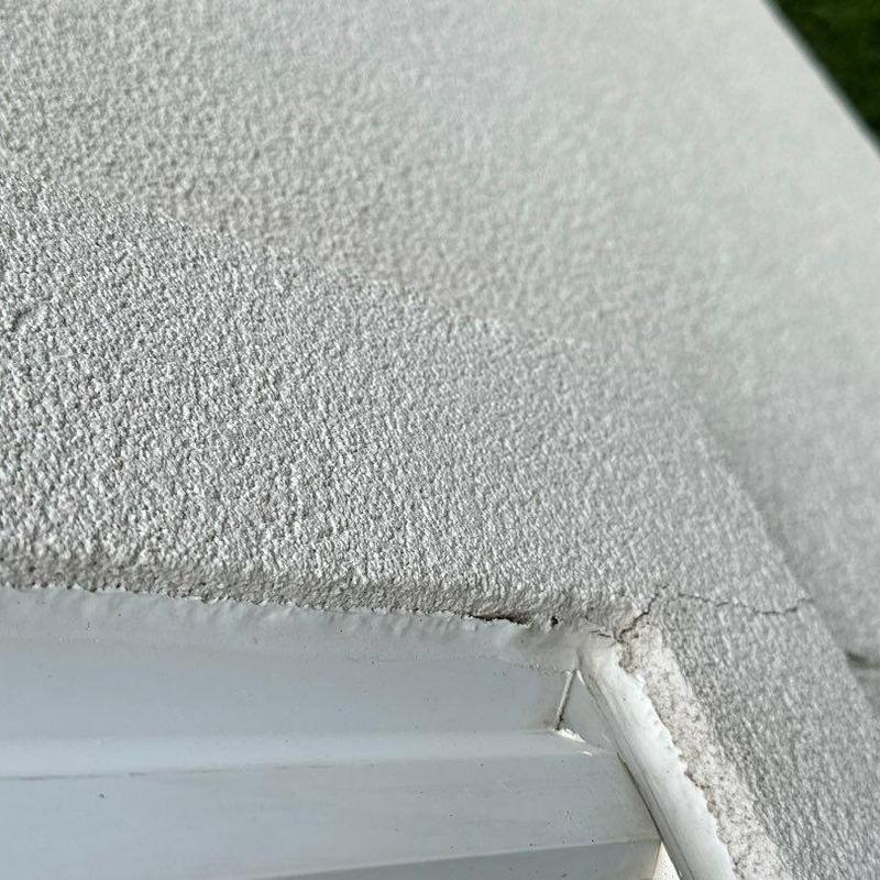 Stucco corner with wall crack near door frame repair Stucco corner with wall crack near door frame repair