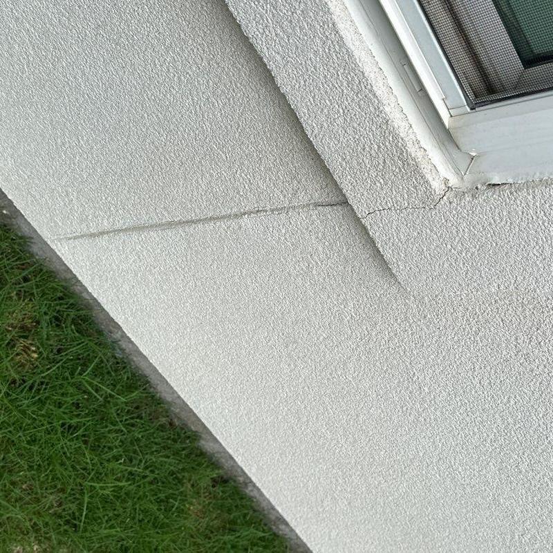 Stucco wall and window frame cracks on home exterior Stucco wall and window frame cracks on home exterior