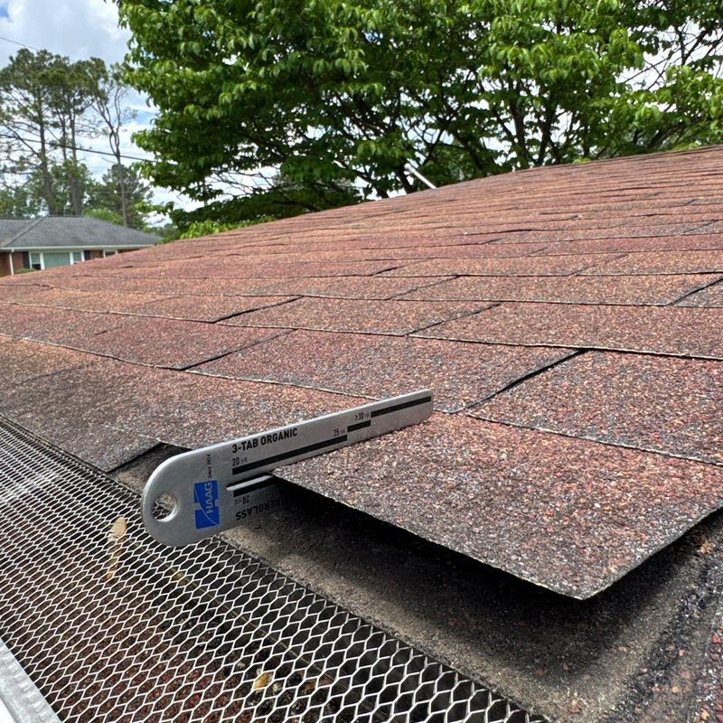 Organic 3-tab shingles with hail damage inspection gauge