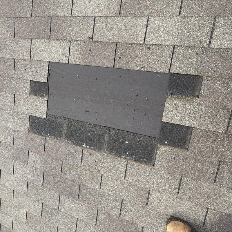 Roof shingles with missing areas on asphalt roof